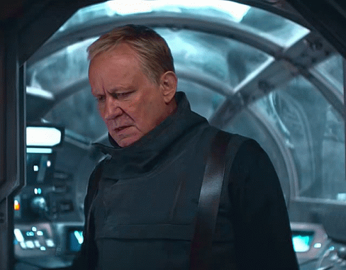 Man In Black Vest In Front Of Glass Door GIF