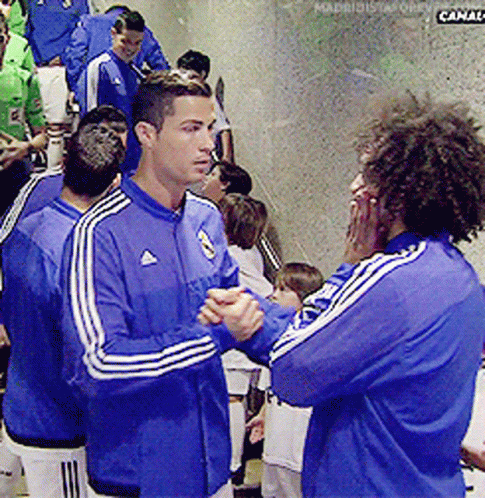 A Man In A Blue Adidas Jacket Talks To Another Man In A Blue Adidas Jacket GIF