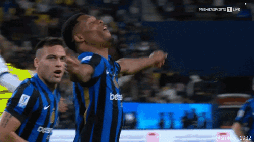 A Man In A Blue And Black Striped Jersey With The Word Bets On It GIF