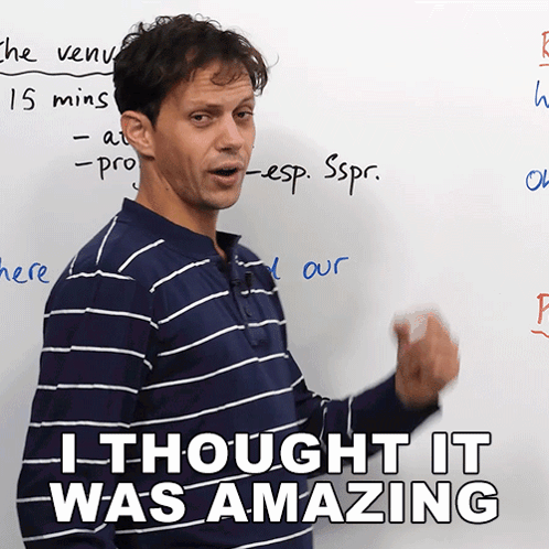 Man In Blue And White Striped Shirt In Front Of Whiteboard GIF