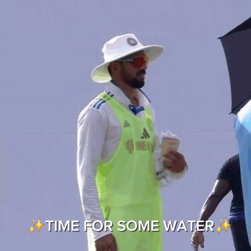 A Man In A Blue Hat Is Talking To Another Man In A White Shirt With The Words Time For Some Water On The Bottom GIF
