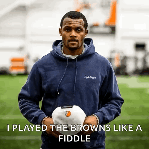 A Man In A Blue Hoodie Is Holding A White Ball With The Words I Played The Browns Like A Fiddle Below Him GIF
