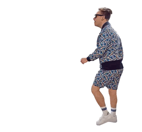 a man in a blue jacket and shorts is dancing with his arm outstretched