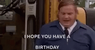 A Man In A Blue Jacket And Tie Is Standing In Front Of A Bus . GIF