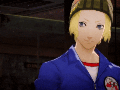A Man In A Blue Jacket Holding A Cell Phone With The Letter R On It GIF