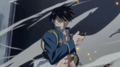 A Man In A Blue Jacket Is Holding A Gun In His Right Hand . GIF