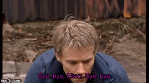 a man in a blue jacket is saying bye bye elton