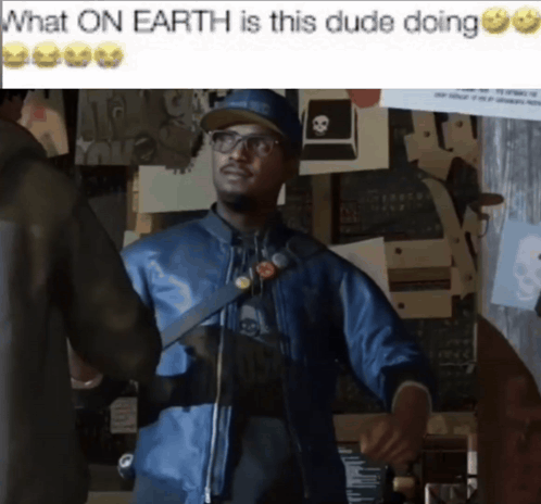 A Man In A Blue Jacket Is Standing In Front Of A Wall With Papers On It And A Caption That Says What On Earth Is GIF