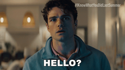 A Man In A Blue Jacket Says Hello In White Letters GIF