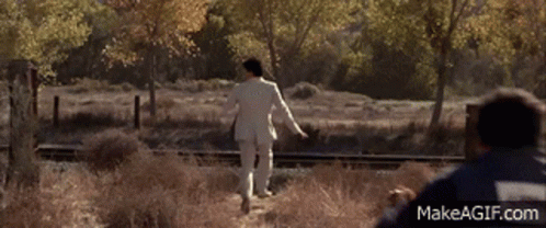 A Man In A Blue Jacket With Makeagif.com On The Bottom Left GIF