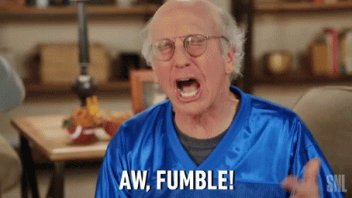 A Man In A Blue Jersey Is Screaming And Saying Aw Fumble . GIF