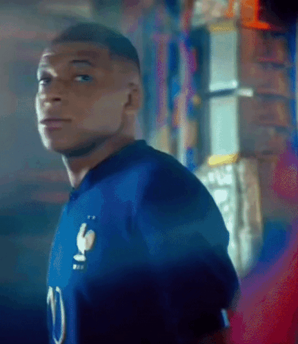 A Man In A Blue Jersey With The Number 10 On It GIF