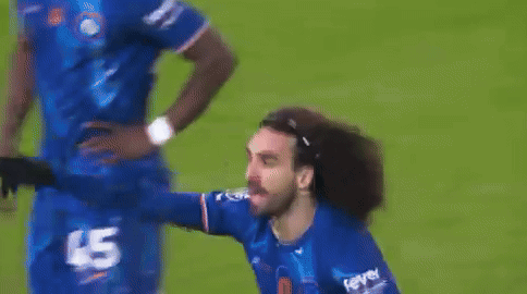 A Man In A Blue Jersey With The Number 45 On It Is Standing On A Soccer Field . GIF