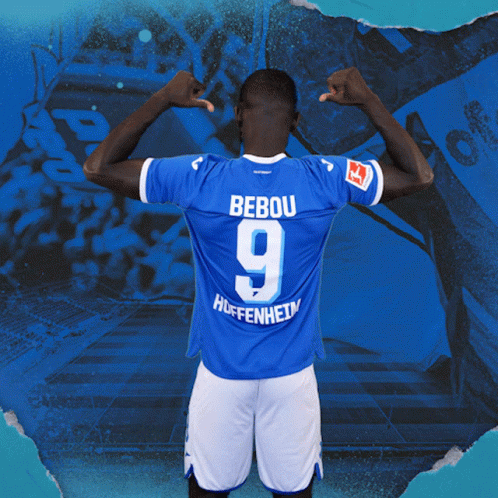 A Man In A Blue Jersey With The Number 9 On The Back GIF