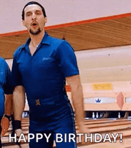 A Man In A Blue Jumpsuit Is Standing In A Bowling Alley And Says `` Happy Birthday '' . GIF