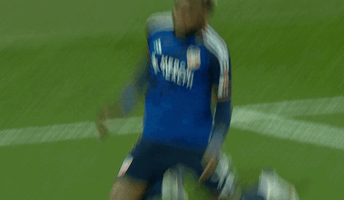 A Man In A Blue Mercy Health Jersey Is Running On A Field GIF