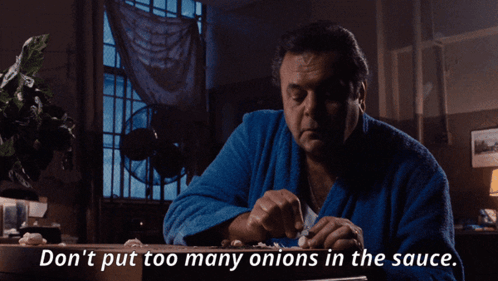 A Man In A Blue Robe Is Cutting Onions And Says " Do N't Put Too Many Onions In The Sauce " GIF