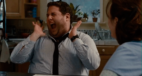 A Man In A Blue Shirt And Black Tie Is Laughing GIF