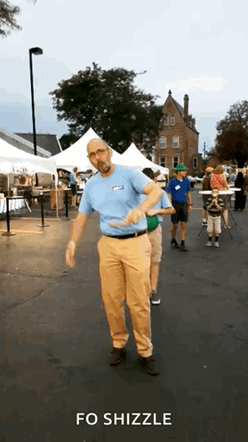 Man In Blue Shirt And Khaki Pants Dancing Parking Lot Fo Shizzle GIF