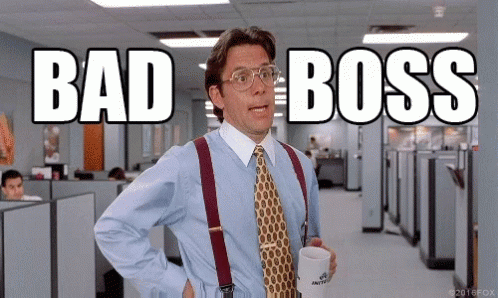 A Man In A Blue Shirt And Tie Is Holding A Cup Of Coffee And Says " Bad Boss " GIF