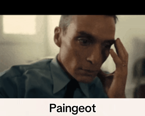 A Man In A Blue Shirt And Tie Is Holding His Hand To His Forehead With The Word Paingeot Written Below Him GIF