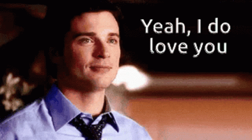 A Man In A Blue Shirt And Tie Is Saying " Yeah I Do Love You " GIF