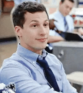 Man In Blue Shirt And Tie At Office Desk GIF