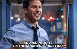 A Man In A Blue Shirt And Tie Is Talking About Christmas . GIF