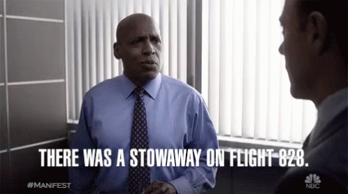 A Man In A Blue Shirt And Tie Is Talking To Another Man With The Words " There Was A Stowaway On Flight 828 " Above Him GIF