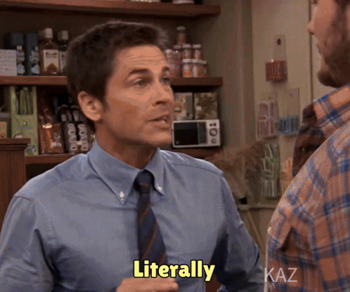 A Man In A Blue Shirt And Tie Says Literally In A Kitchen GIF