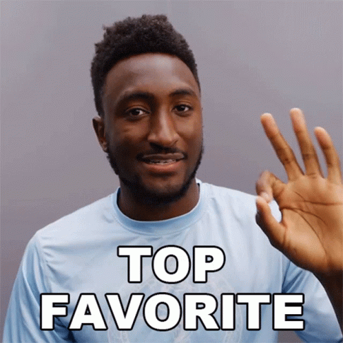 A Man In A Blue Shirt Giving An Ok Sign With The Words Top Favorite Behind Him GIF