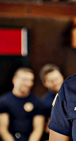 a man in a blue shirt has a badge on his shoulder that says ' u.s. army '