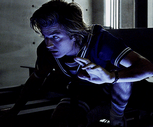 A Man In A Blue Shirt Has A Watch On His Wrist That Says Uc GIF