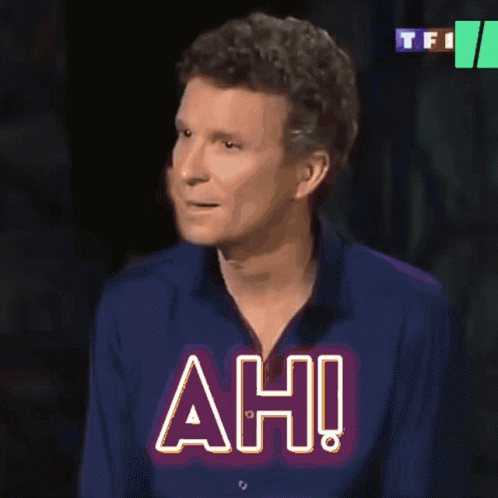Man In Blue Shirt With Ah On Chest GIF