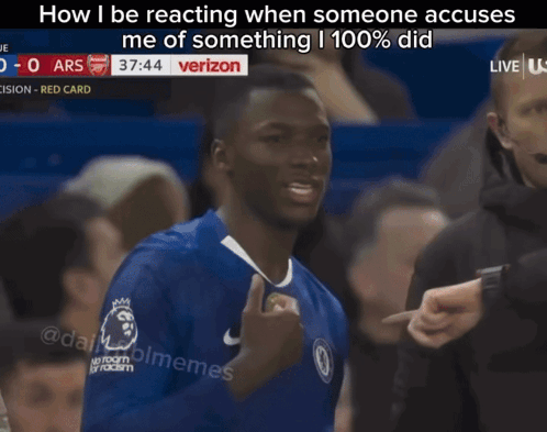 A Man In A Blue Shirt Is Giving A Thumbs Up In Front Of A Verizon Sign GIF