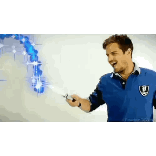 a man in a blue shirt is holding a knife in front of a graph