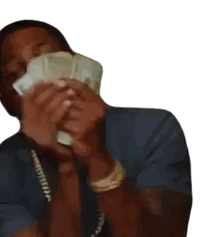 a man in a blue shirt is holding a stack of money in front of his face