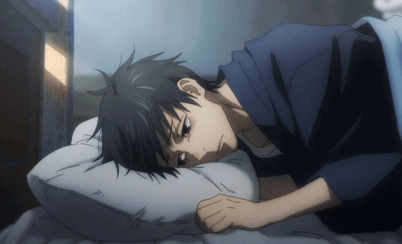 A Man In A Blue Shirt Is Laying On A Bed With His Head On A White Pillow GIF