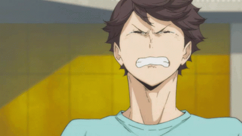 A Man In A Blue Shirt Is Making A Funny Face GIF