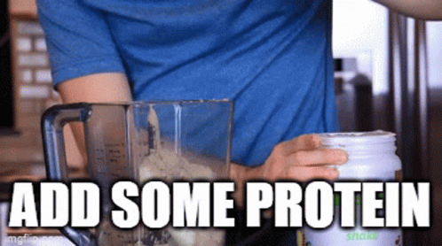 A Man In A Blue Shirt Is Making A Smoothie With The Words " Add Some Protein " Above Him GIF