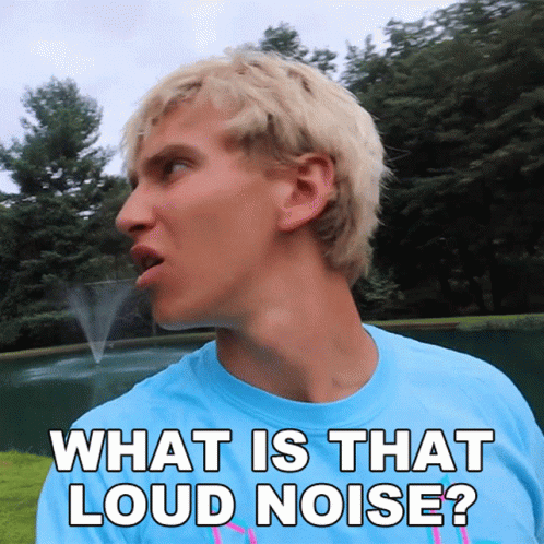 A Man In A Blue Shirt Is Saying What Is That Loud Noise GIF