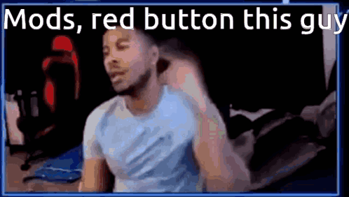A Man In A Blue Shirt Is Sitting In Front Of A Screen With The Words Mods , Red Button This Guy . GIF