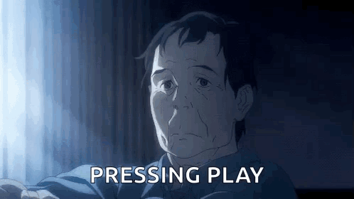 A Man In A Blue Shirt Is Sitting In Front Of A Window . GIF