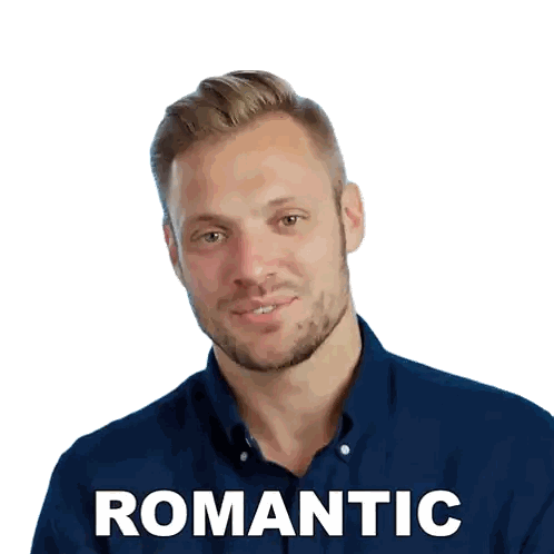 a man in a blue shirt is smiling and the word romantic is above his head