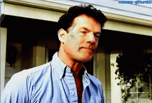 A Man In A Blue Shirt Is Standing In Front Of A House With The Words Mistress-Gif Tumblr Written On The Bottom GIF
