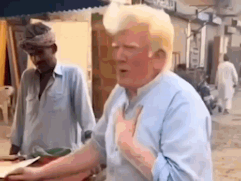 A Man In A Blue Shirt Is Standing In Front Of A Man In A Blue Shirt . GIF