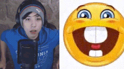 a man in a blue shirt is talking into a microphone next to a smiley face with a big mouth and teeth .