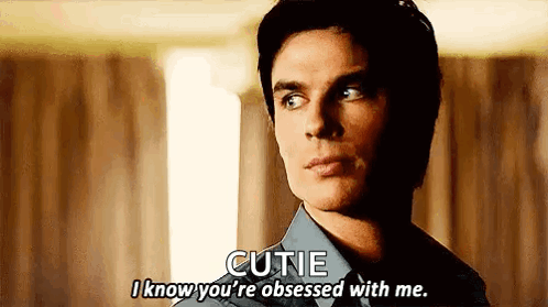 A Man In A Blue Shirt Is Talking To Another Man . GIF