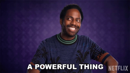 A Man In A Blue Shirt Says " A Powerful Thing " In Front Of A Purple Background GIF