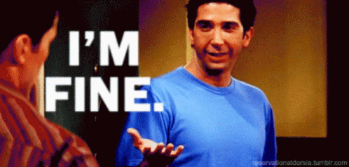 A Man In A Blue Shirt Says " I 'M Fine " In White Letters GIF